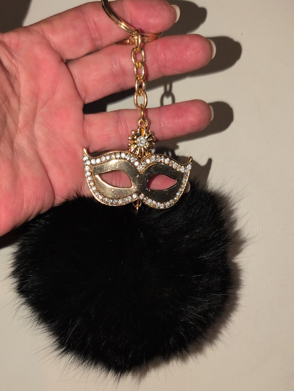Gold Toned Mask Rhinestone With Black Pom Pom Keychain Bag Charm